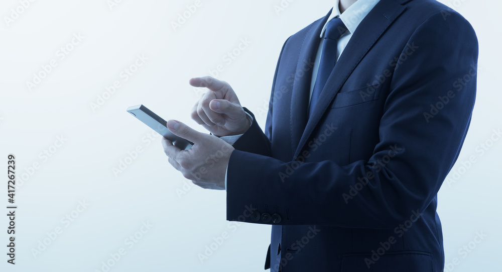 Aufkleber businessperson using smartphone. gray background with copy space. side view.