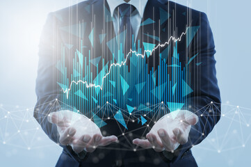 Business innovation and economic boom. Business person holding network structure and growth graphs.