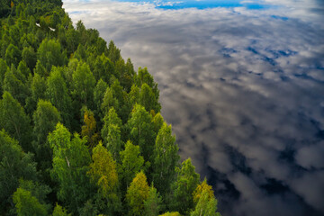 Fototapeta na wymiar Clouds reflection in lake in northern Sweden