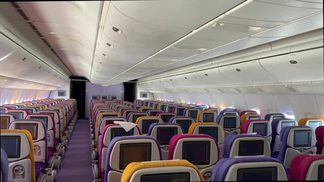 Nobody, empty seat in cabin of airplane flying in sky during COVID.