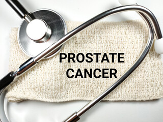Medical concept.Word PROSTATE CANCER with stethoscope on white background.