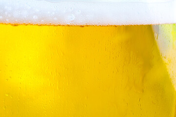 Background Cool beers with beer bubbles on top a glass at the party