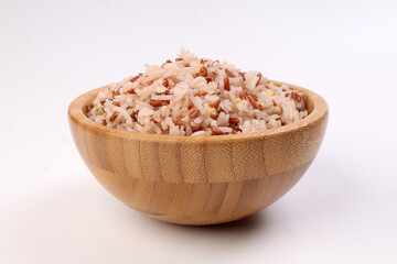 Fototapeta na wymiar Cooked mixed low glycaemic index healthy rice grain basmati millet buckwheat red rice in wooden bowl on white background
