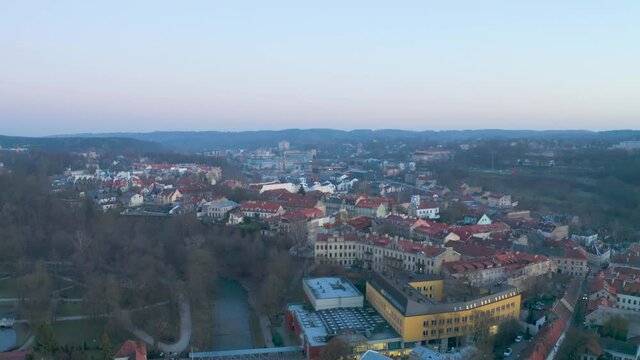 Aerial wide shot of the old town in Vilnius city at sunset.