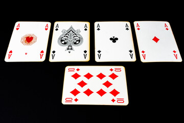 Obraz premium Poker of aces on a black surface. concept card games, gambling