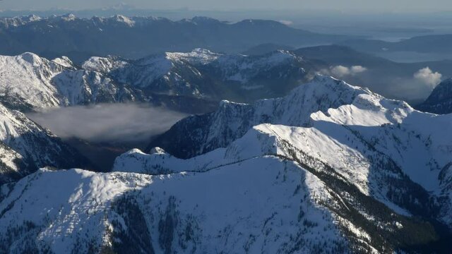 Snowcapped Mountain Ranges Surrounds At Salmon Inlet (Sechelt Inlet) In British Columbia, Canada. - Aerial Wide Shot