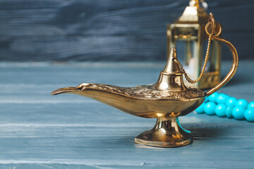 Fototapeta na wymiar Aladdin lamp of wishes on table