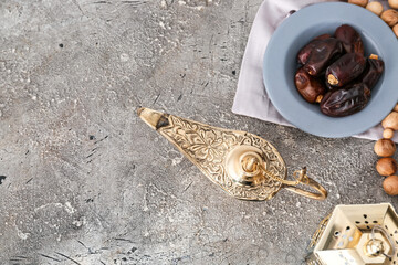 Aladdin lamp of wishes and dates on grunge background