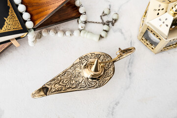 Aladdin lamp of wishes on light background