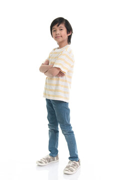 Cute Asian child looking with crossed arms on white background isolated