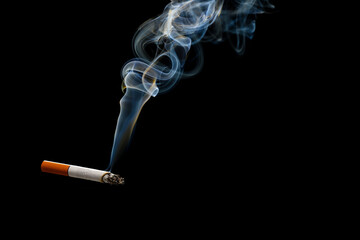Cigarette with smoke on dark background