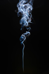 Cigarette smoke on dark background