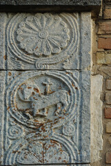 Moscufo - Abruzzo - Abbey of Santa Maria del Lago - Side detail of the portal with flat relief elements.
