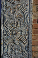 Moscufo - Abruzzo - Abbey of Santa Maria del Lago - Side detail of the portal with flat relief elements.