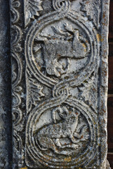 Moscufo - Abruzzo - Abbey of Santa Maria del Lago - Side detail of the portal with flat relief elements.