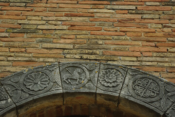 Moscufo - Abruzzo - Abbey of Santa Maria del Lago - Upper detail of the portal, you can see the cruciferous lamb.