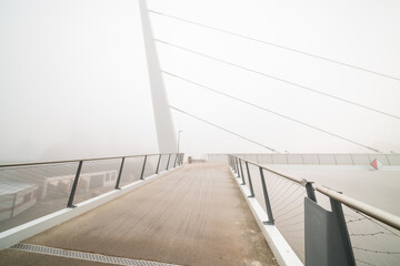 bicycle pedestrian bridge with fog