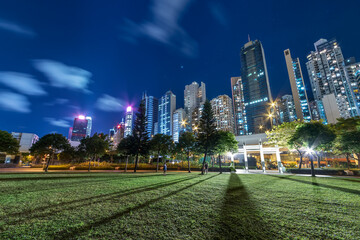 Fototapeta na wymiar High rise office building and public park in downtown of Hong Kong city at night