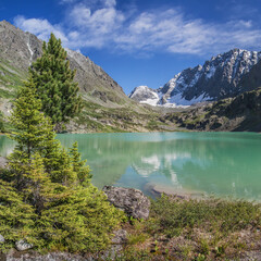 A picturesque lake in the Altai mountains on a summer morning