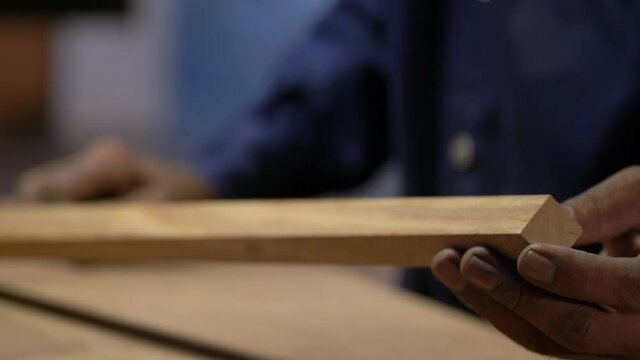 Closeup Shot Of Woodworker Installing Wood To Table Top With Glue, Furniture Making Factory