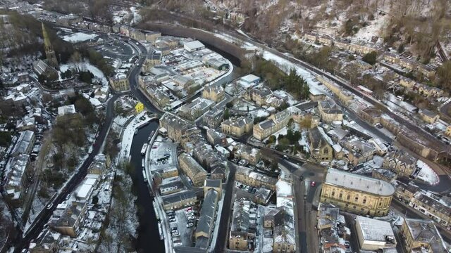 Birds eye view of todmorden north west yorkshire after snow fall  , drone footage
