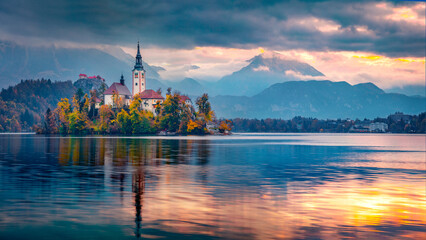 Сharm of the ancient cities of Europe. Panoramic morning view of Pilgrimage Church of the Assumption of Maria. Exciting autumn scene of Bled lake, Julian Alps, Slovenia, Europe.