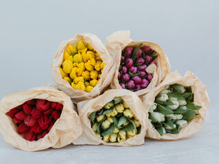 Spring tulips floral tulip bunch. Tulips of different varieties.