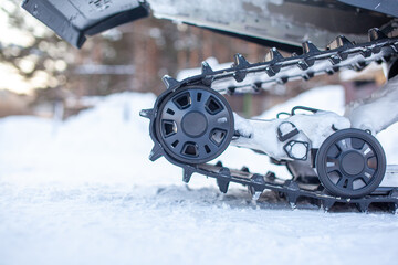 Rear suspension of a snowmobile in winter. Riding in the snow
