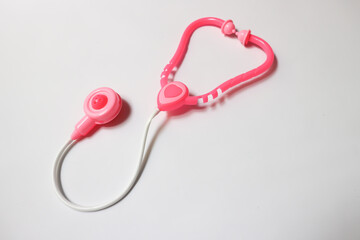 stethoscope and heart on white