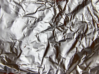 texture of silvery crumpled aluminum foil background