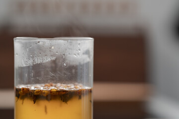 brew tea with ginger in beaker glass