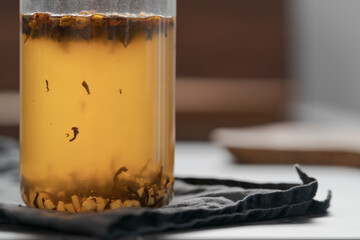 brew tea with ginger in beaker glass
