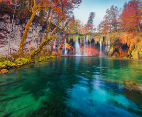 Beautiful autumn scenery. Splendid morning view of pure water waterfall in Plitvice National Park. Stunning autumn scene of Croatia, Europe. Beauty of nature concept background.