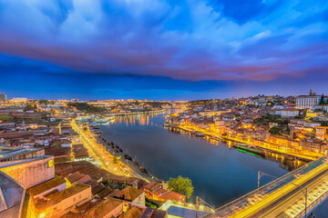 Fototapeta premium Porto Portugal night city skyline at Porto Ribeira and Douro River and Dom Luis I Bridge