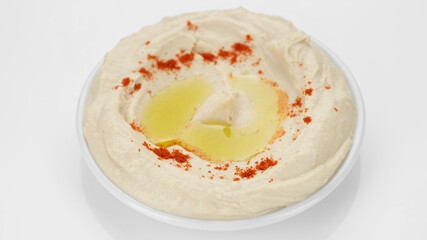 plate of hummus with smoked paprika and olive oil on white background. Healthy vegan food