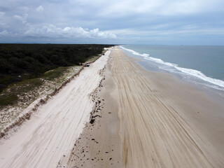 Beautiful Bribie Island, Queensland, Australia featuring beach, water, fauna, vehicles and bright summer sunshine