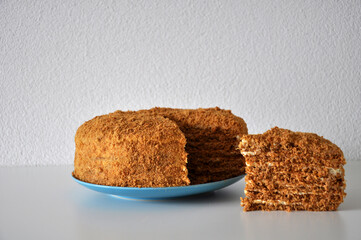Honey Homemade Cake on Blue Plate on the Table