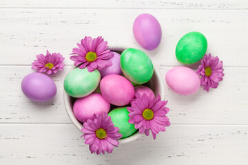 Easter greeting card with colorful easter eggs and flowers