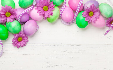 Easter greeting card with colorful easter eggs and flowers