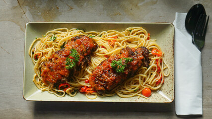 spaghetti honey-glazed duck breast with sauce served with aglio e olio spaghetti