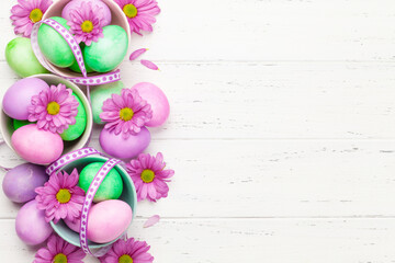 Easter greeting card with colorful easter eggs and flowers
