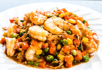 Fried  prawns with chopped green peas corns and carrots , Thai street food