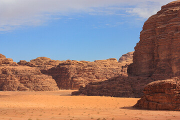Fototapeta na wymiar beautiful red relief mountains in the Wadi Rum desert, Jordan, clear sunny day, contrasting shadows
