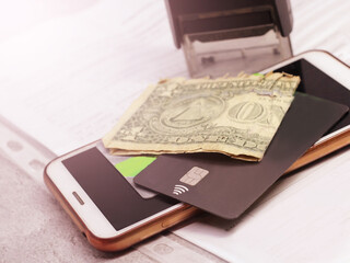 Bank card, dollars and smartphone, credit