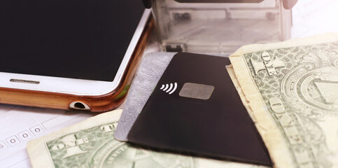 Bank card, dollars and smartphone, credit