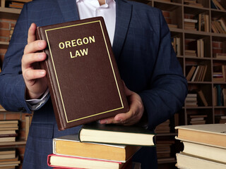 Book with title OREGON LAW . Oregon residents are subject to Oregon state and U.S. federal laws