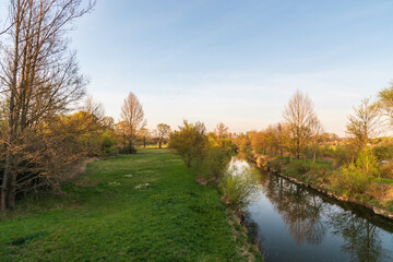 Springtime CHKO Poodri near Ostrava city in Czech republic with Odra river, meadow and trees