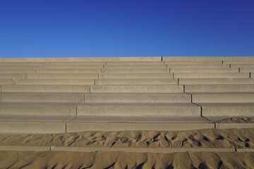 海岸の堤防へあがる階段と青空/The stairs of embankment prevent from tsunami at beach...