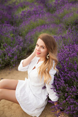 Young woman having fun in a lavender field