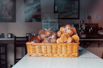 bread rolls in plastic bag in basket ready to deliver